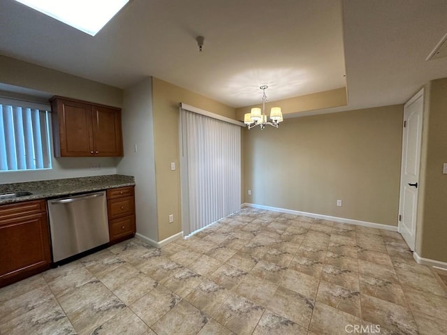 kitchen with a chandelier, dishwasher, sink, and hanging light fixtures