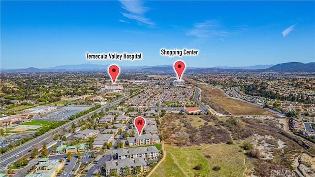 aerial view featuring a residential view and a mountain view