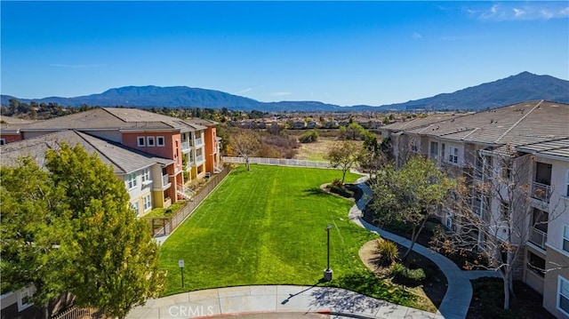 birds eye view of property with a residential view and a mountain view