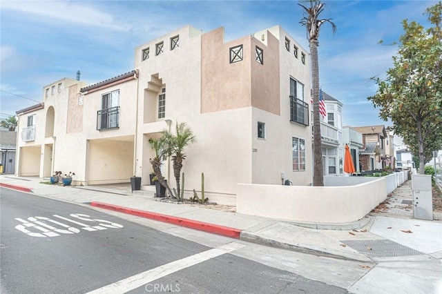 view of property with a residential view and fence