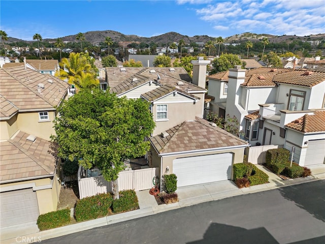 birds eye view of property featuring a mountain view