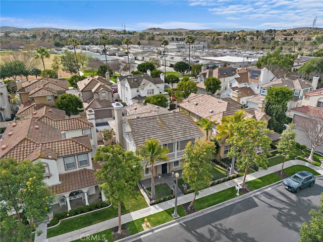 birds eye view of property featuring a mountain view