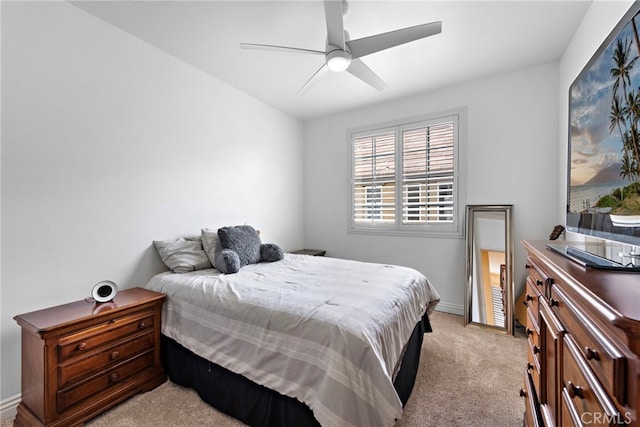 bedroom featuring light colored carpet and ceiling fan