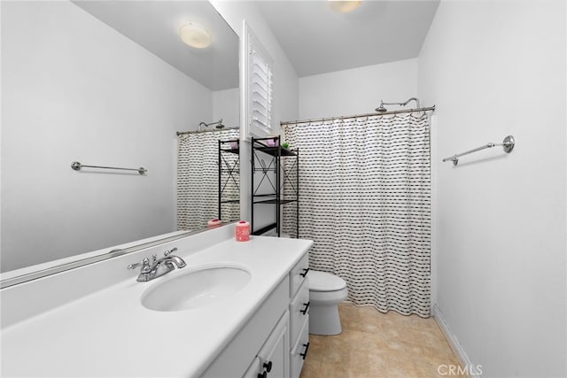 bathroom with vanity, curtained shower, tile patterned floors, and toilet