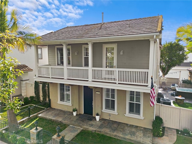 view of front of home with a balcony