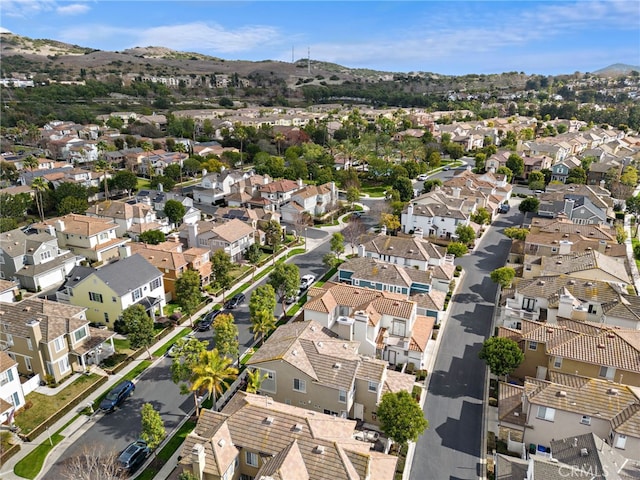 birds eye view of property featuring a mountain view