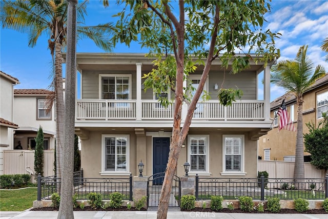 view of front of home featuring a balcony