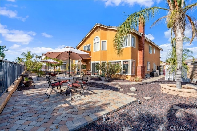 back of house with a patio area