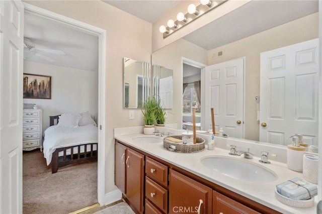 bathroom featuring ceiling fan and vanity
