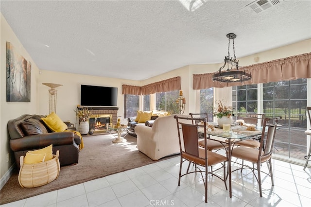 living room featuring a textured ceiling, light carpet, and a brick fireplace