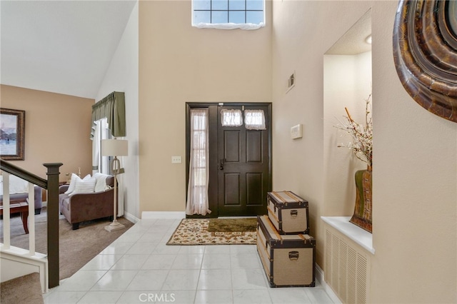 entrance foyer with high vaulted ceiling
