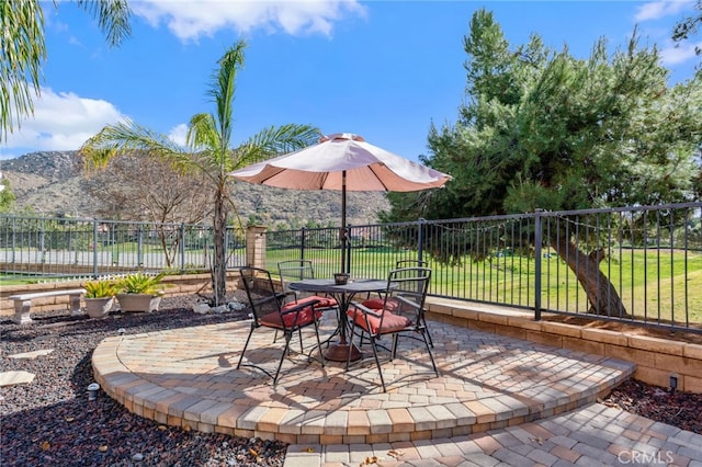 view of patio / terrace with a mountain view