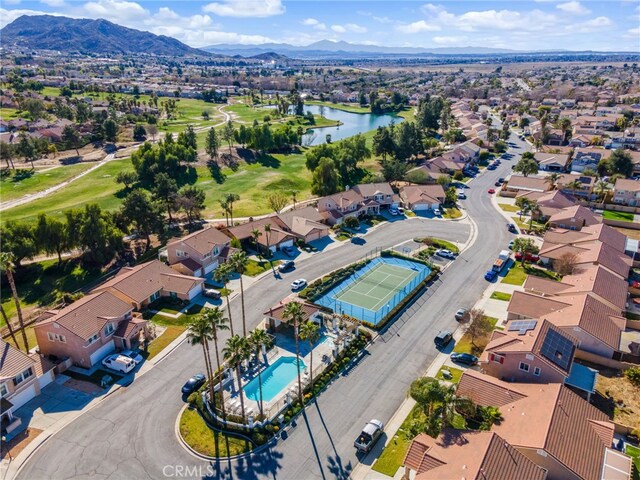 birds eye view of property featuring a water and mountain view
