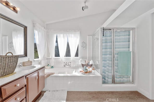 bathroom with vanity, shower with separate bathtub, and lofted ceiling