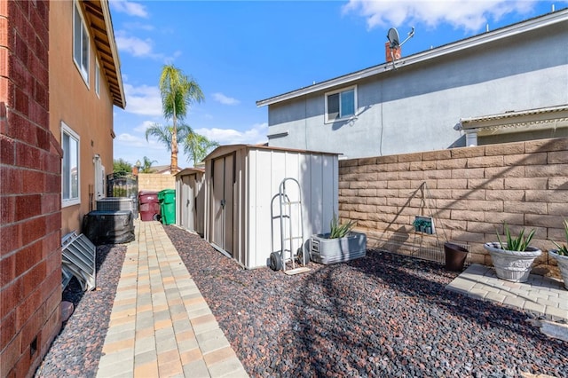 view of side of property with a storage unit