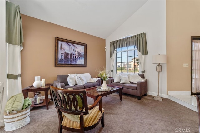 living area featuring high vaulted ceiling and carpet flooring