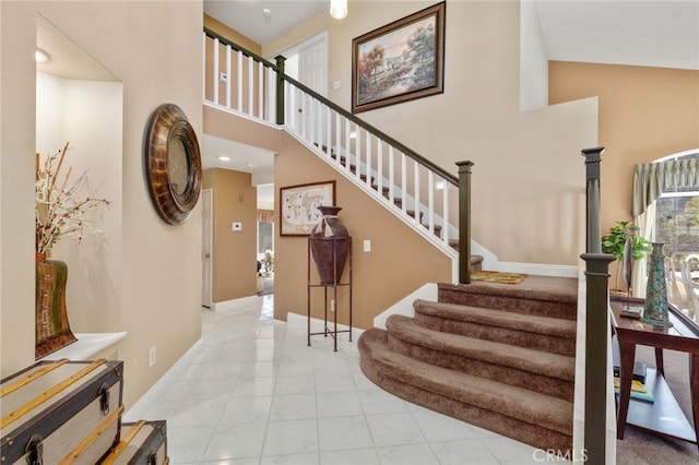 entryway featuring a towering ceiling