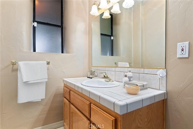 bathroom with vanity and backsplash