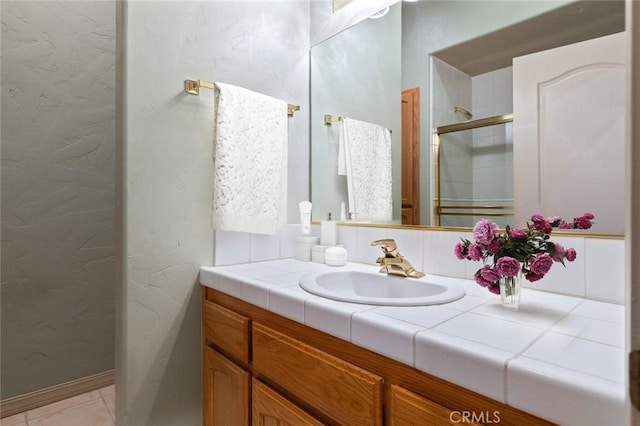 bathroom featuring vanity and walk in shower