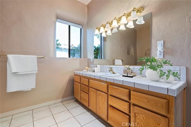 bathroom with vanity and tile patterned flooring