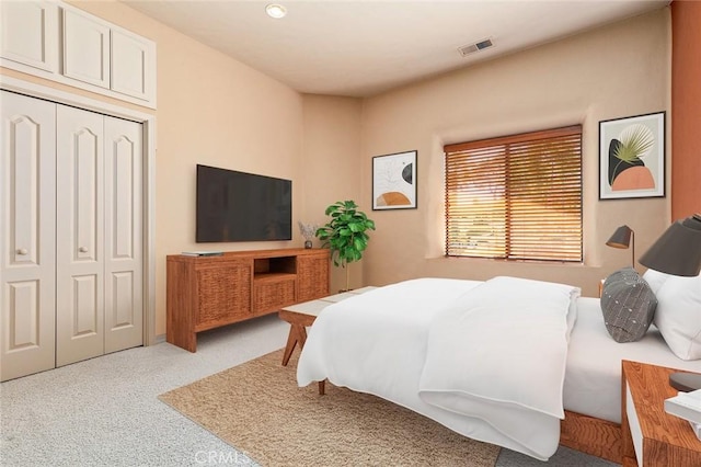 carpeted bedroom with a closet