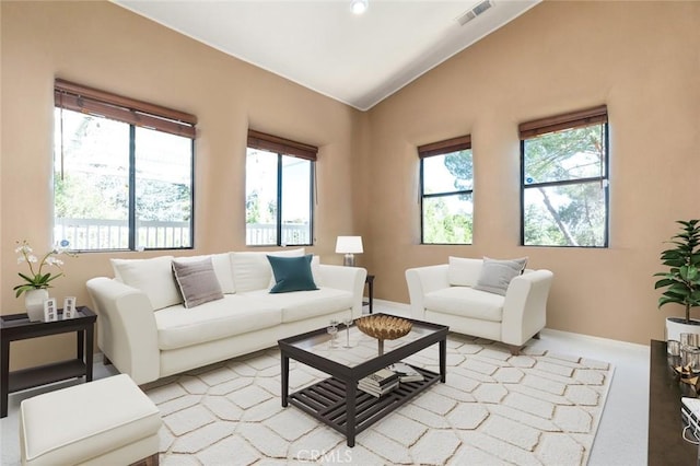 living room featuring vaulted ceiling