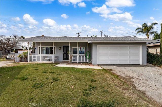 ranch-style house featuring a garage, a front lawn, and a porch