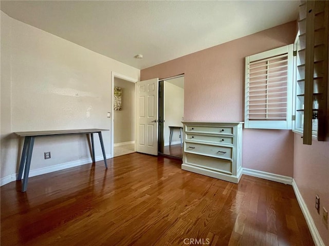 unfurnished bedroom featuring hardwood / wood-style flooring