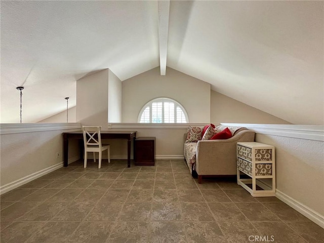 interior space featuring vaulted ceiling with beams