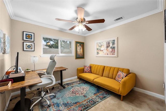 office space with crown molding, ceiling fan, and carpet flooring