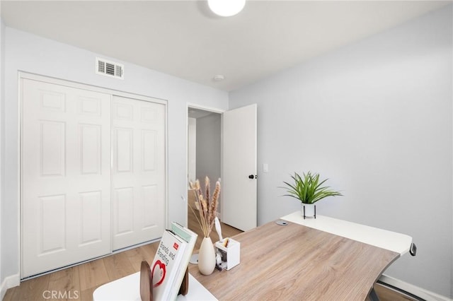 office space with hardwood / wood-style flooring