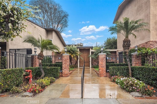 view of gate with fence