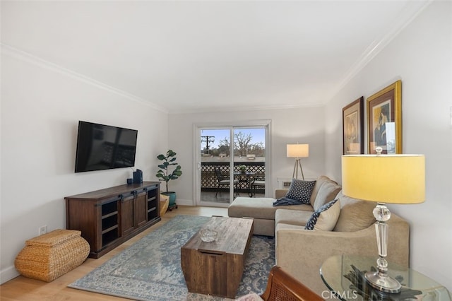 living room featuring crown molding and wood finished floors