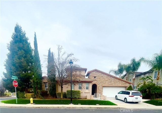 view of front facade with a front lawn and a garage