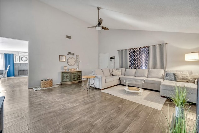 44536 Benald St, Lancaster, CA 93535 - living room featuring hardwood / wood-style floors, lofted ceiling, ceiling fan, and a textured ceiling