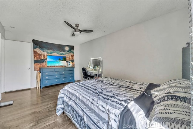 44536 Benald St, Lancaster, CA 93535 - bedroom with a textured ceiling, ceiling fan, and dark hardwood / wood-style floors