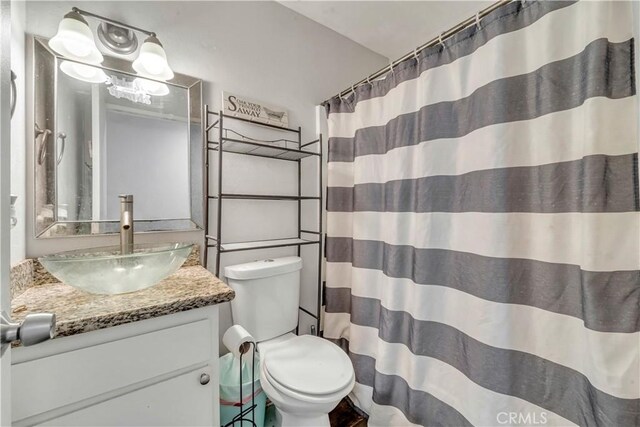 44536 Benald St, Lancaster, CA 93535 - bathroom featuring vanity, toilet, and walk in shower