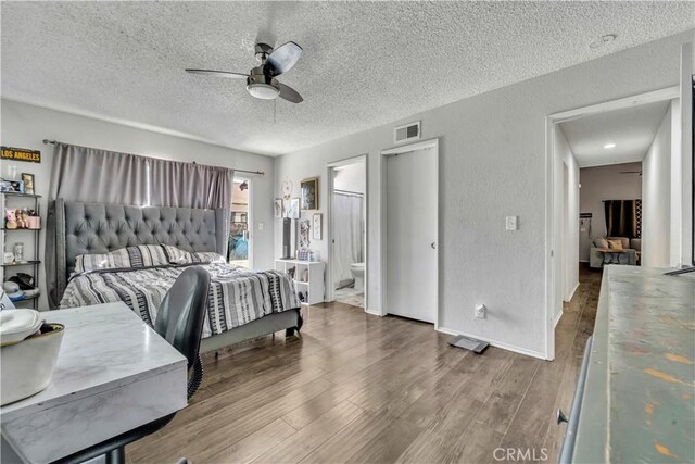 44536 Benald St, Lancaster, CA 93535 - bedroom featuring a textured ceiling, connected bathroom, ceiling fan, and wood-type flooring