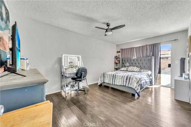 44536 Benald St, Lancaster, CA 93535 - bedroom with a textured ceiling, dark hardwood / wood-style floors, and ceiling fan