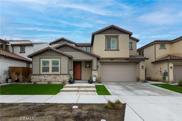 view of front facade featuring an attached garage, stone siding, a front lawn, and concrete driveway