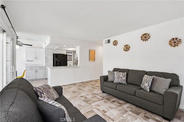 living room featuring ceiling fan