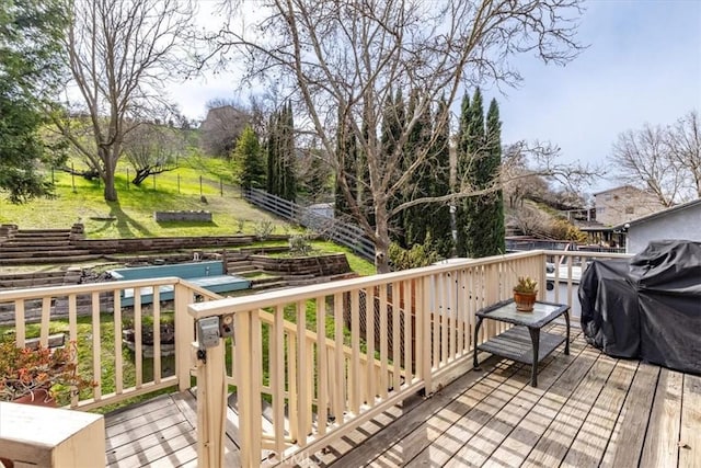 deck with a yard and grilling area