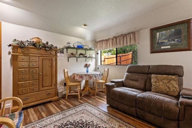 sitting room with hardwood / wood-style flooring