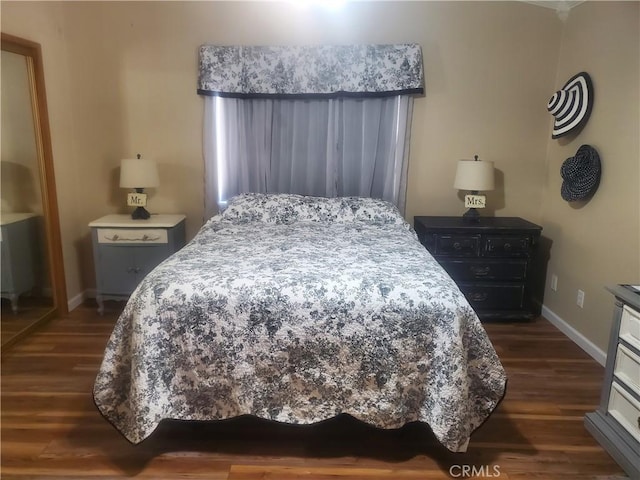 bedroom featuring dark hardwood / wood-style floors