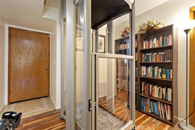 doorway with wood-type flooring