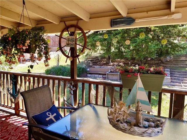 wooden balcony featuring a deck