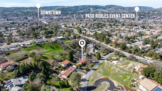 birds eye view of property with a mountain view