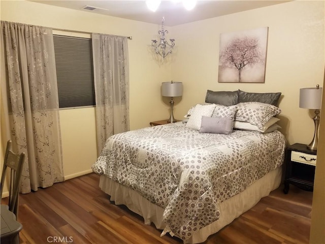 bedroom featuring dark wood-type flooring