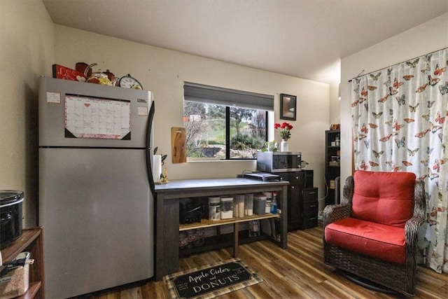 sitting room featuring dark hardwood / wood-style floors