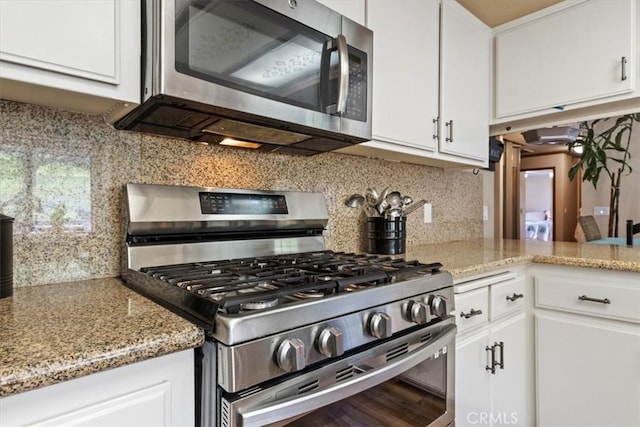 616 Jackson Dr, Paso Robles, CA 93446 - kitchen with stainless steel appliances, white cabinets, backsplash, and light stone countertops